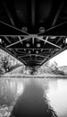 Monochrome shot of a bridge over the river