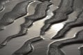 Monochrome shot of the tidal texture of coastal wet mudflat