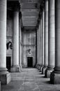 Monochrome tall classical columns stone walls and door in the portico of leeds town hall in west yorkshire