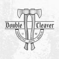 Monochrome two ax logo on light gray wall background. Double cleaver text. Axe with a wooden handle emblem design. Carpentry tool