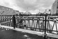 Monochrome urban landscape on rainy day. View of the Yauza river embankment through the bridge Visokoyauzskiy, Moscow, Russia. Royalty Free Stock Photo