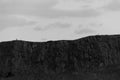 Monochrome view- Arthur`s Seat hills and two people, Edinburgh, Royalty Free Stock Photo