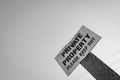 Monochrome view of a Private Property sign.