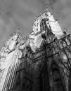 Monochrome view of the towers at the entrance to york minster in sunlight against a cloudy sky