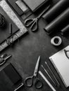 Monochrome Workspace Featuring Wrapping Tools and Stationery on a Desk With a Top View in a Creative Setting Royalty Free Stock Photo