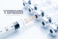 Monoclonal antibodies concept image: syringe draws liquid from a vial