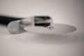 Monocrome macro shot of a metal pizza cutter Royalty Free Stock Photo