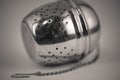 Monocrome macro shot of a metal tea strainer Royalty Free Stock Photo