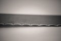 Monocrome macro shot of a stainless steel bread cutting knife Royalty Free Stock Photo