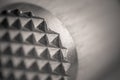 Monocrome macro shot of a wooden meat tenderizer, metal end Royalty Free Stock Photo