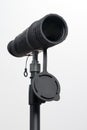 Monocular on a tripod isolated on a white field. Royalty Free Stock Photo