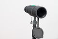 Monocular on a tripod isolated on a white field. Royalty Free Stock Photo