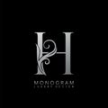 Monogram Luxury H Logo Letter. Simple luxuries vector design concept abstract nature floral leaves silver color