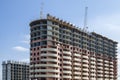 Two-tone highrise building under construction. Royalty Free Stock Photo