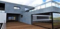 Monolithic concrete as a wall finish on the second floor of a suburban elite cottage. Eco-friendly pine floor board. Mirrored Royalty Free Stock Photo