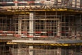 Monolithic construction of a multi-storey apartment building. Construction site. Construction in progress and concrete house frame