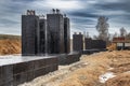 Monolithic reinforced concrete foundation waterproofed with bituminous mastic. Rostverk at the construction site. Construction pit Royalty Free Stock Photo