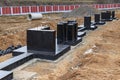 Monolithic reinforced concrete foundation waterproofed with bituminous mastic. Rostverk at the construction site. Construction pit Royalty Free Stock Photo
