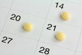 Monophasic Birth Control Pills on a Calendar Royalty Free Stock Photo