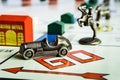 Monopoly Board Game - Car token followed closely by other tokens Royalty Free Stock Photo