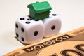 Monopoly money, dice and house Royalty Free Stock Photo