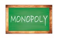 MONOPOLY text written on green school board