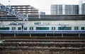 The Monorail Train Is Approaching Station. The White Metro Train Is Arriving To The Platform In Tokyo, Japan. Royalty Free Stock Photo