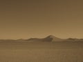 Monotone image of beautiful natural sand dune curved ridge with soft shadow on vast empty dried desert landscape and clear sky Royalty Free Stock Photo