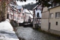 Monreal, Germany - 02 09 2021: River Elz between half-timbered houses and the old stone bridge Royalty Free Stock Photo
