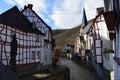 Monreal, Germany - 02 12 2020: Elz between half-timbered houses at the church Royalty Free Stock Photo