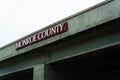 Monroe County sign on bridge