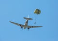 An army paratrooper jumping from a C-47 cargo aircraft