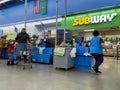 Monroe, WA USA - circa December 2022: Wide view of people using the self checkout section of a Walmart store Royalty Free Stock Photo