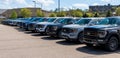 Monroeville, Pennsylvania, USA April 16, 2023 A line of new Ford F150 pickup trucks for sale at a dealership