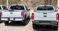 Monroeville, Pennsylvania, USA April 16, 2023 Two new, white Ford pick up trucks, a Ranger and an F150 for sale at a dealership