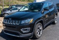 Monroeville, Pennsylvania, USA April 16, 2023 A used, black Jeep Compass SUV for sale at a dealership