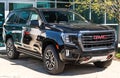 Monroeville, Pennsylvania, USA March 24, 2024 A 2024 black GMC Yukon AT4 SUV for sale at a dealership