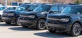 Monroeville, Pennsylvania, USA March 26, 2023 Three black Ford Bronco SUVs lined up for sale at a dealership