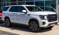 Monroeville, Pennsylvania, USA March 24, 2024 A 2024 white GMC Yukon AT4 SUV for sale at a dealership