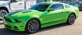 Monroeville, Pennsylvania, USA November 12, 2023 A used green Ford Mustang coupe for sale at a dealership