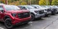 Monroeville, Pennsylvania, USA October 15, 2023 A line of GMC pickup trucks for sale at a dealership
