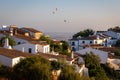 Monsaraz, Portugal - August 2022: Typical country houses and hot air balloons