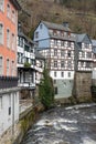 Cityscape view of Monschau and typical half-timbered German houses along the river.