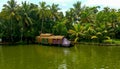 Scenic Houseboat on the backwaters during monsoon in Alleppey, Kerala, India