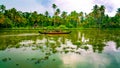 Scenic Houseboat on the backwaters during monsoon in Alleppey, Kerala, India