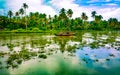 Scenic Houseboat on the backwaters during monsoon in Alleppey, Kerala, India