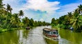 Scenic Houseboat on the backwaters during monsoon in Alleppey, Kerala, India