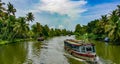 Scenic Houseboat on the backwaters during monsoon in Alleppey, Kerala, India