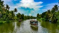 Scenic Houseboat on the backwaters during monsoon in Alleppey, Kerala, India