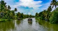 Scenic Houseboat on the backwaters during monsoon in Alleppey, Kerala, India